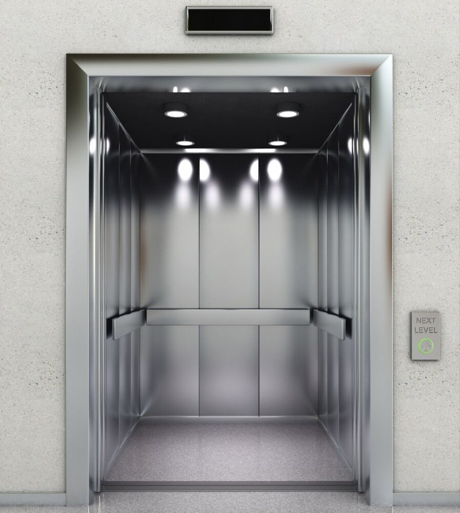 Open elevator cabin with metal interior
